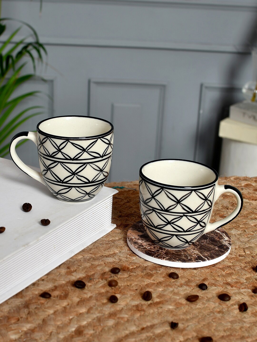 

Aapno Rajasthan White & Black 2 Pieces Printed Ceramic Glossy Cups and Mugs