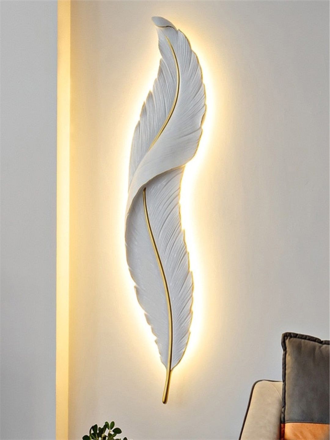 

The Art House Gold Toned & White Nordic Feather Abstract Shaped Wall Lamp