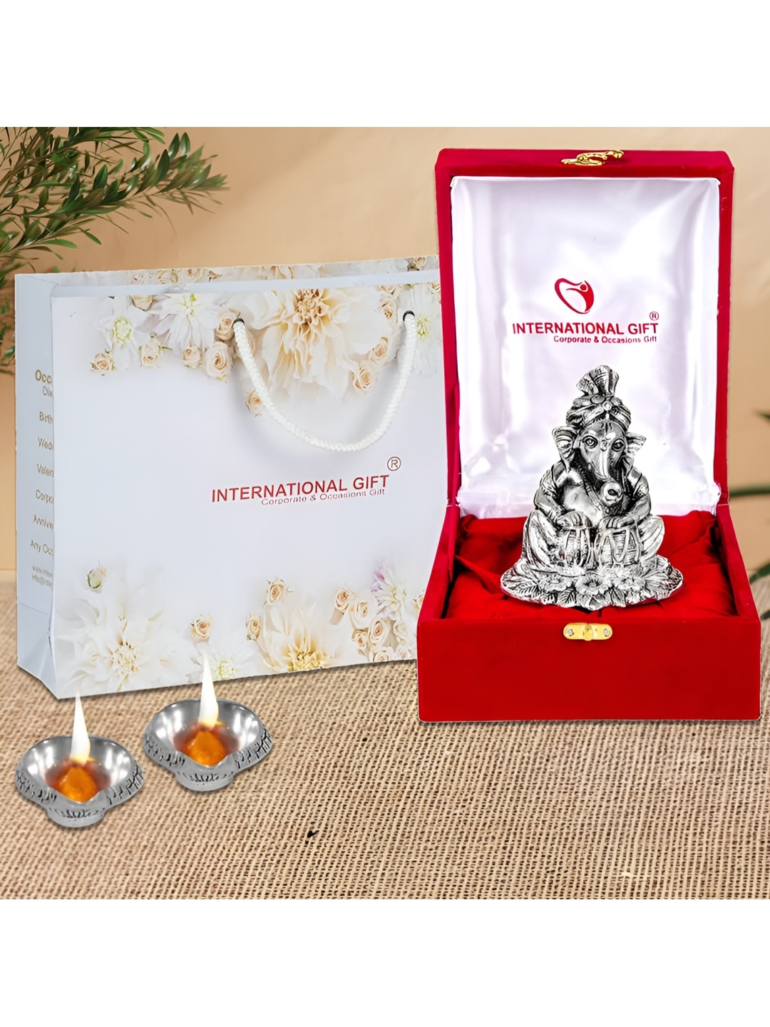 

INTERNATIONAL GIFT Grey & Red Ganesh With Diya Gift Sets
