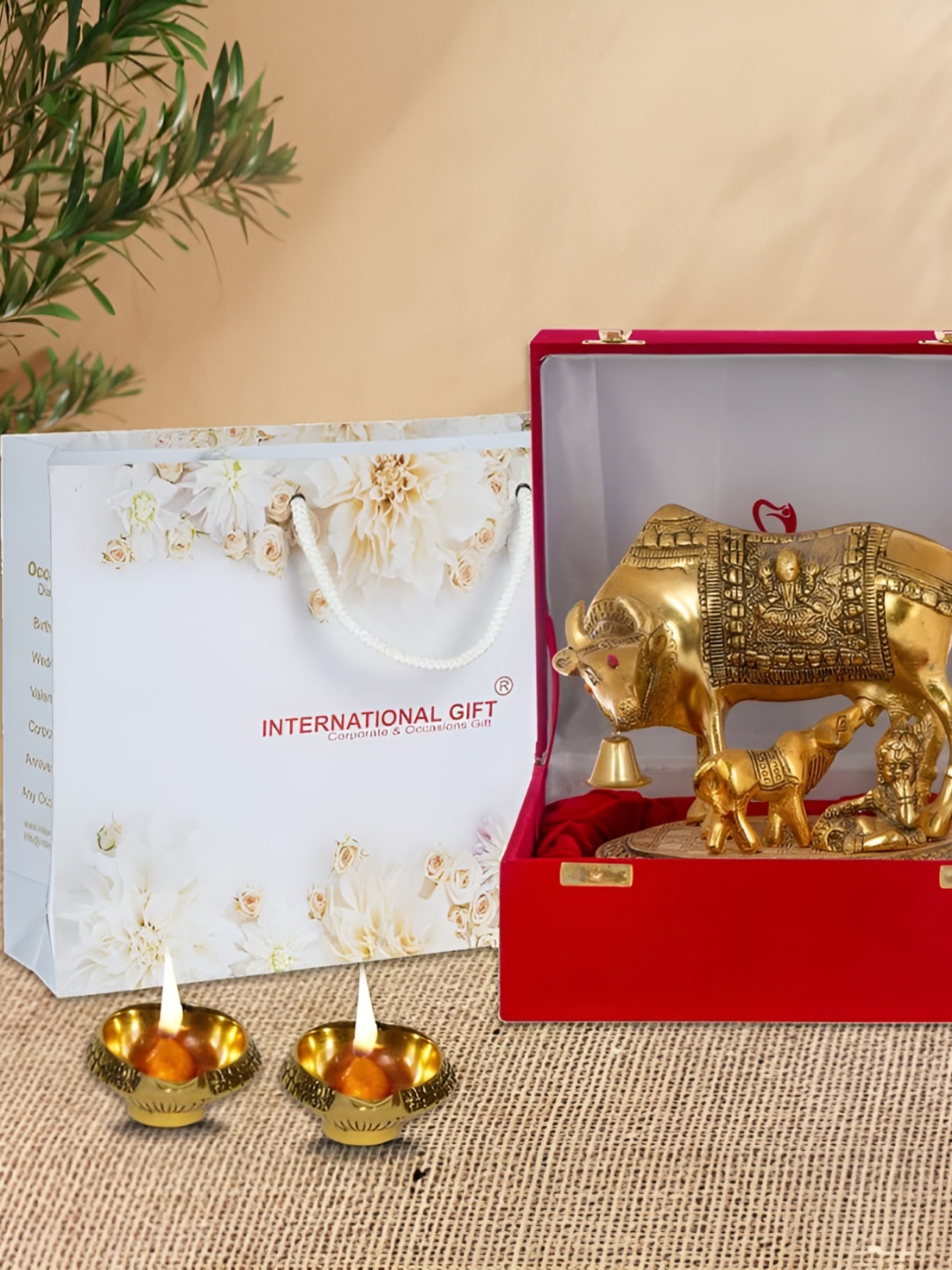 

INTERNATIONAL GIFT Gold Toned 7 Pcs Kamdhenu Cow With Calf With Diya Gift Set