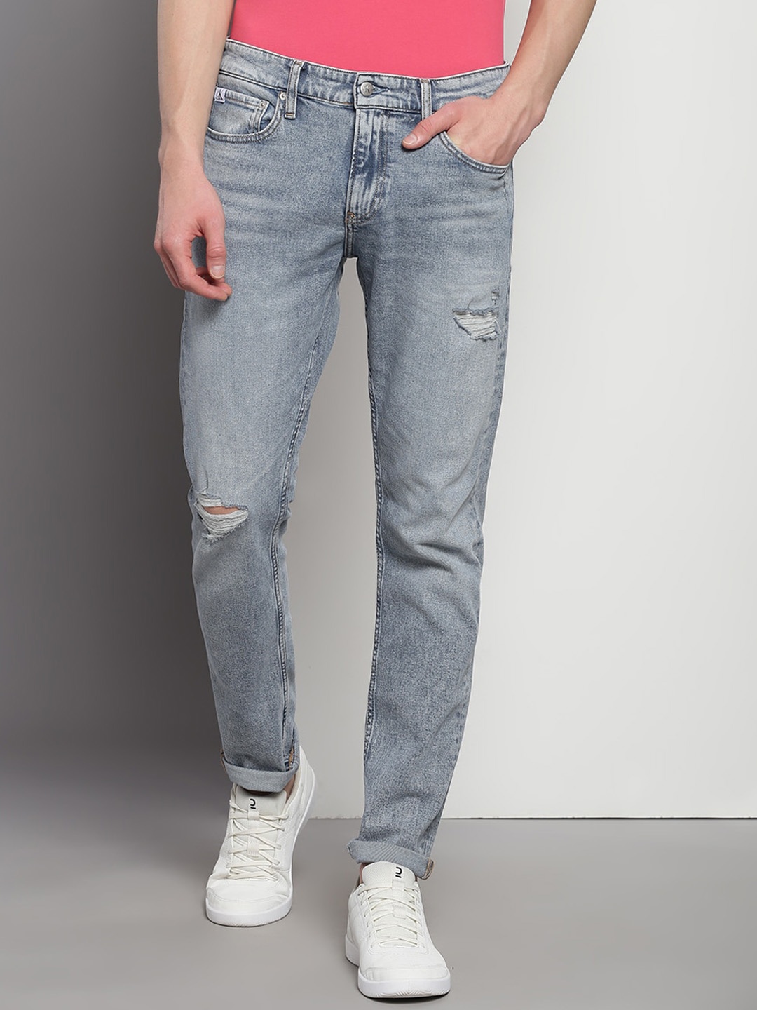 

Calvin Klein Jeans Men Slim Fit Light Fade Mildly Distressed Jeans, Blue