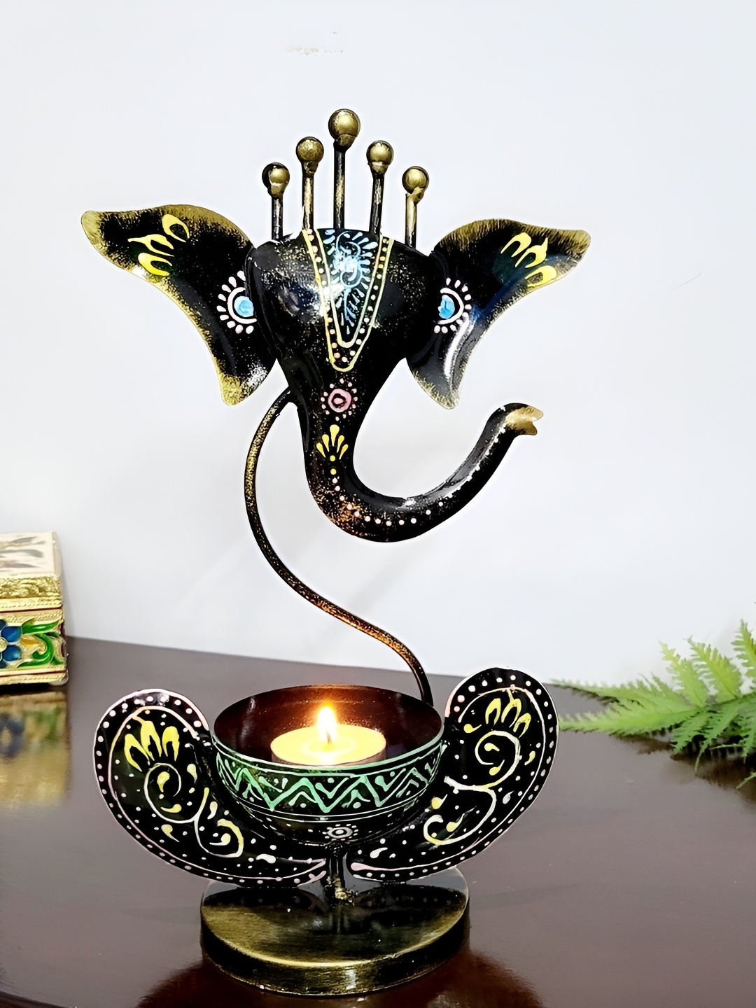 

Kittens Black & Yellow Ganesha Metal Figurine Showpiece