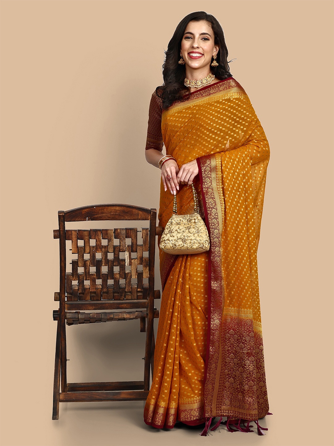 

Vardha Ethnic Motifs Woven Design Zari Pure Georgette Banarasi Saree, Mustard