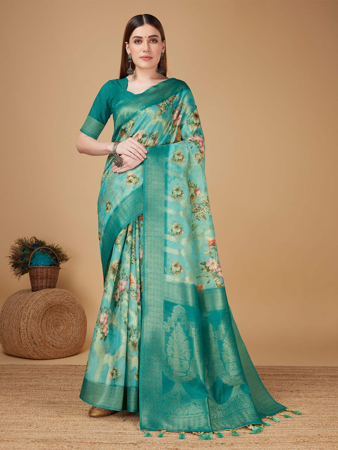 

Mitera Teal Silk Floral Printed Zari Silk Cotton Banarasi Saree