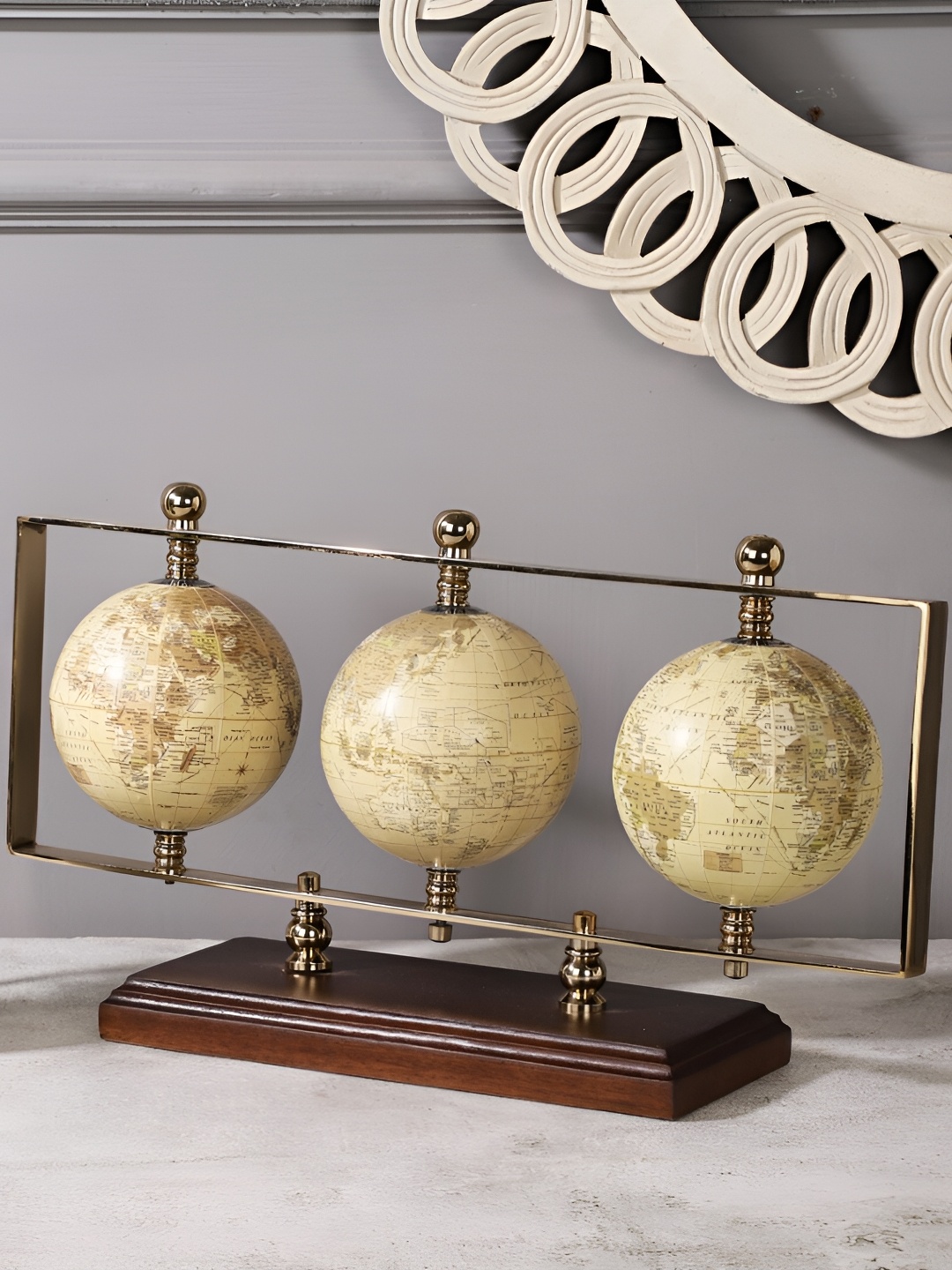 

Decor de Maison Gold-Toned Triple Vertical Globe Stand Showpiece