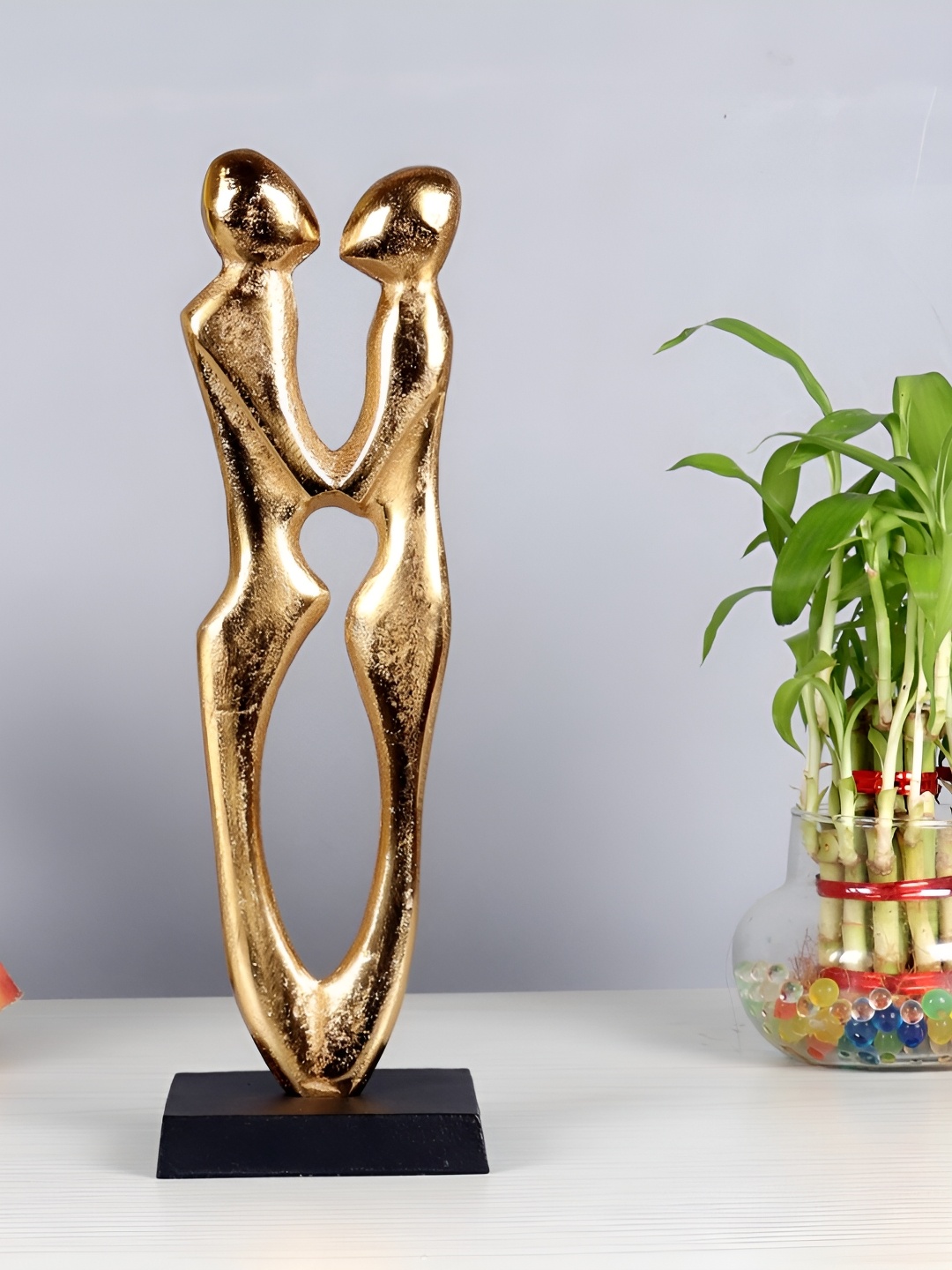 

Decor de Maison Gold-Toned Couple Statue Showpiece
