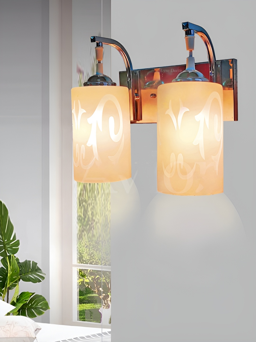 

Lyse Decor Silver Toned Metal Cylindercal Shaped Wall Lamp
