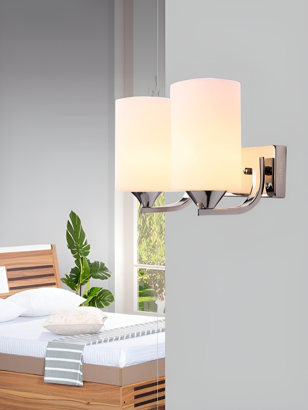 

Lyse Decor Silver Toned Metal Cylindercal Shaped Wall Lamp