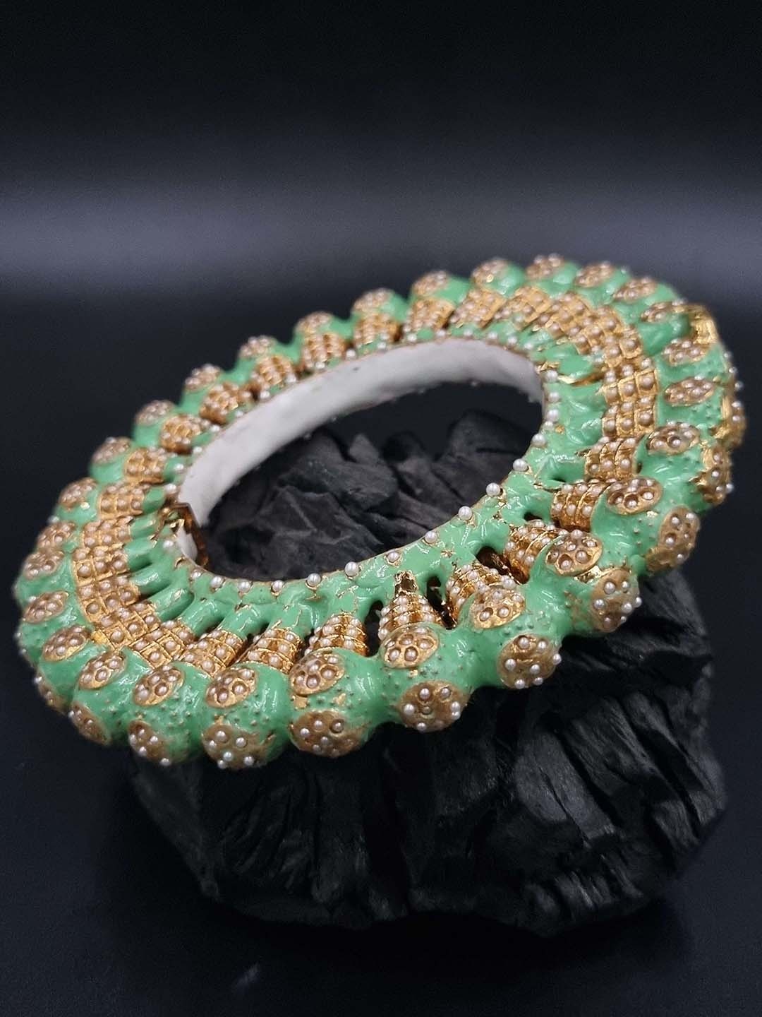

Anouk Gold Plated Beaded Ethnic Rajasthani Bangle
