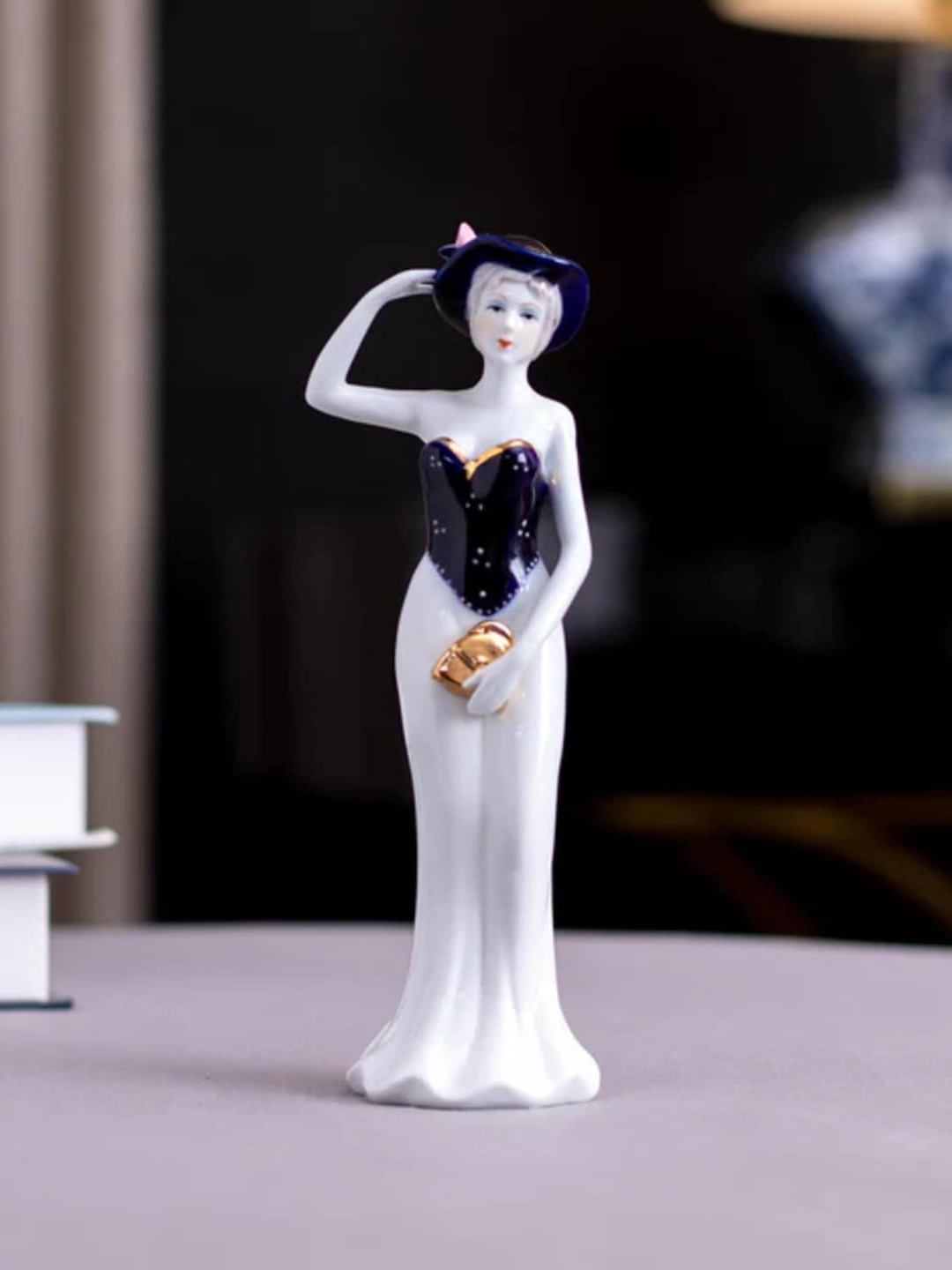 

THEDECORKART White & Navy Blue Lady Figurine Ceramic Showpiece
