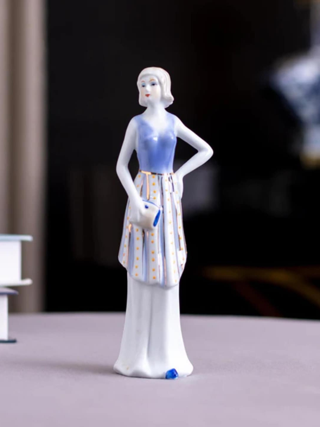 

THEDECORKART White & Blue Ceramic Victorian Lady Figurine Showpiece
