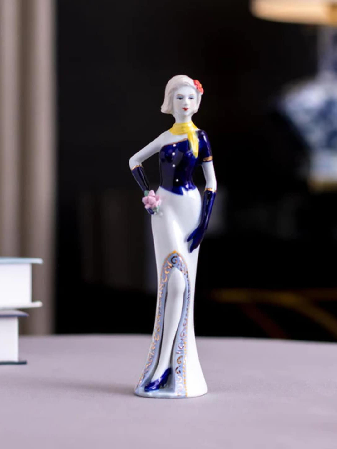 

THEDECORKART White & Navy Blue Ceramic Victorian Lady Figurine Showpiece