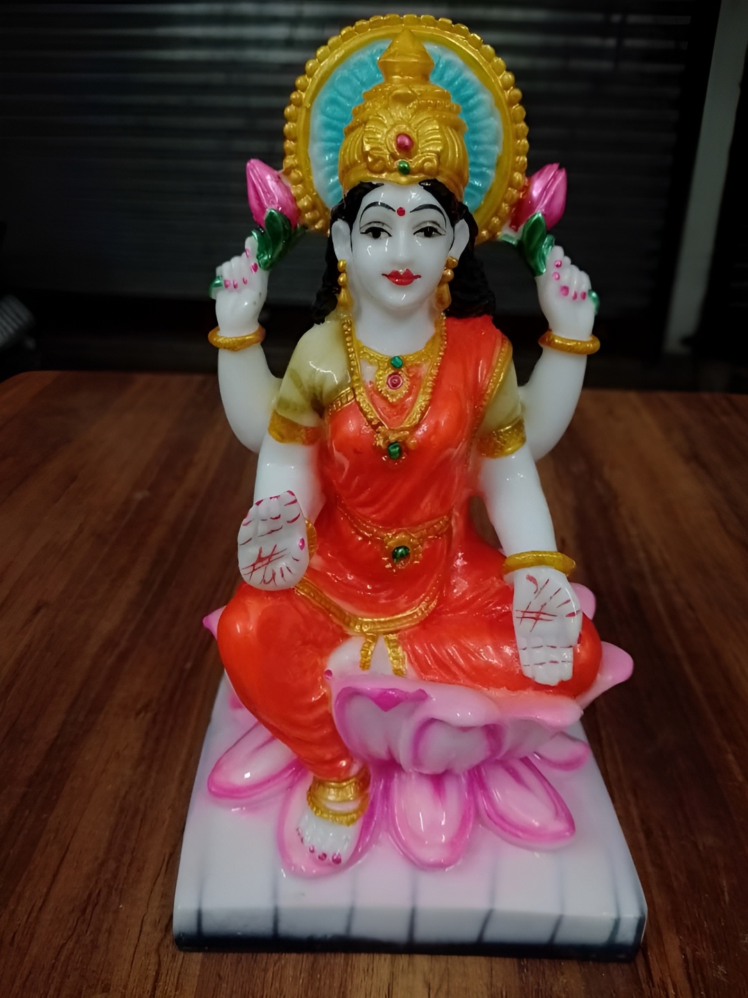 

VAMIKA HANDICRAFTS Orange & White Laxmi Medium Idol Showpiece