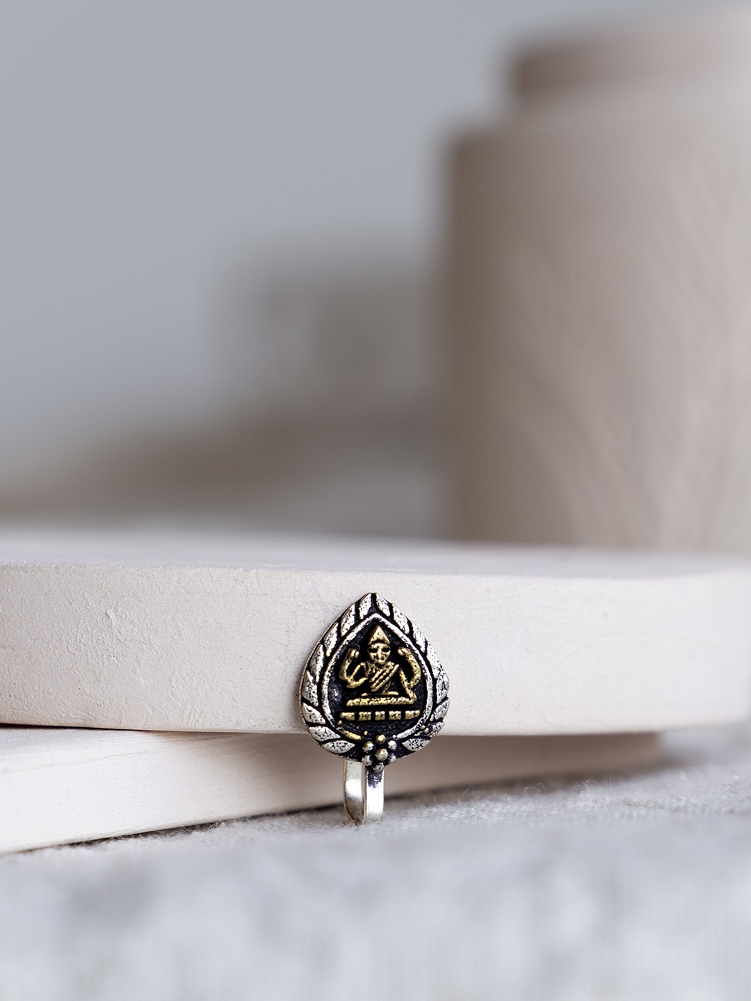 

Infuzze Oxidised Silver & Gold-Toned Goddess Lakshmi Textured Nosepin