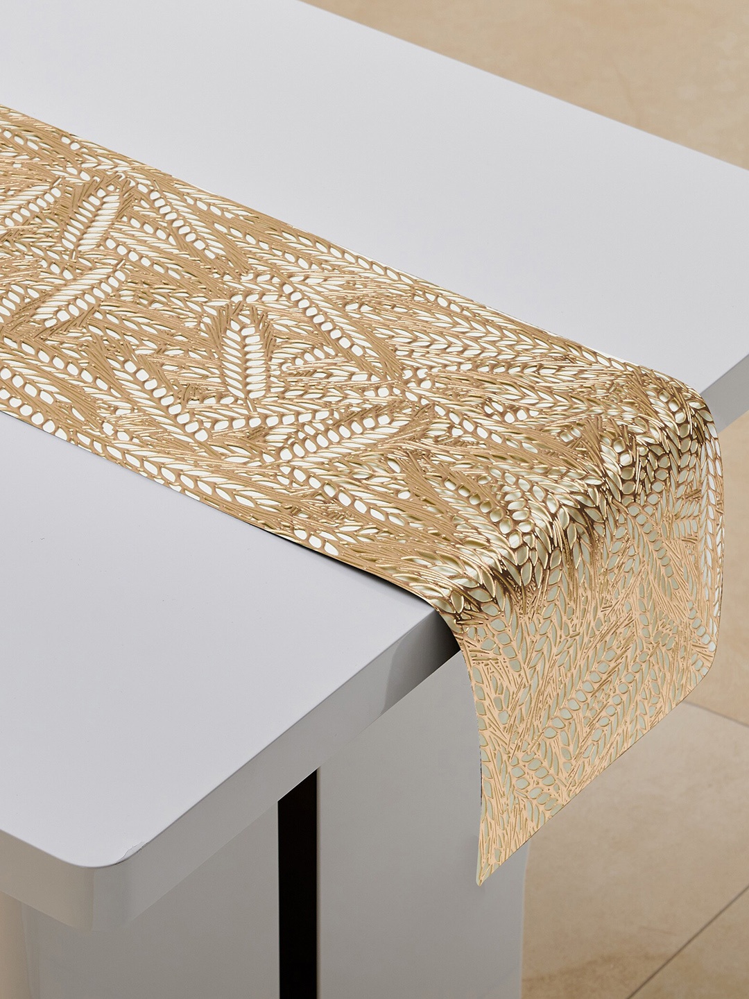 

Home Centre Gold Toned Laser Cut Table Runner