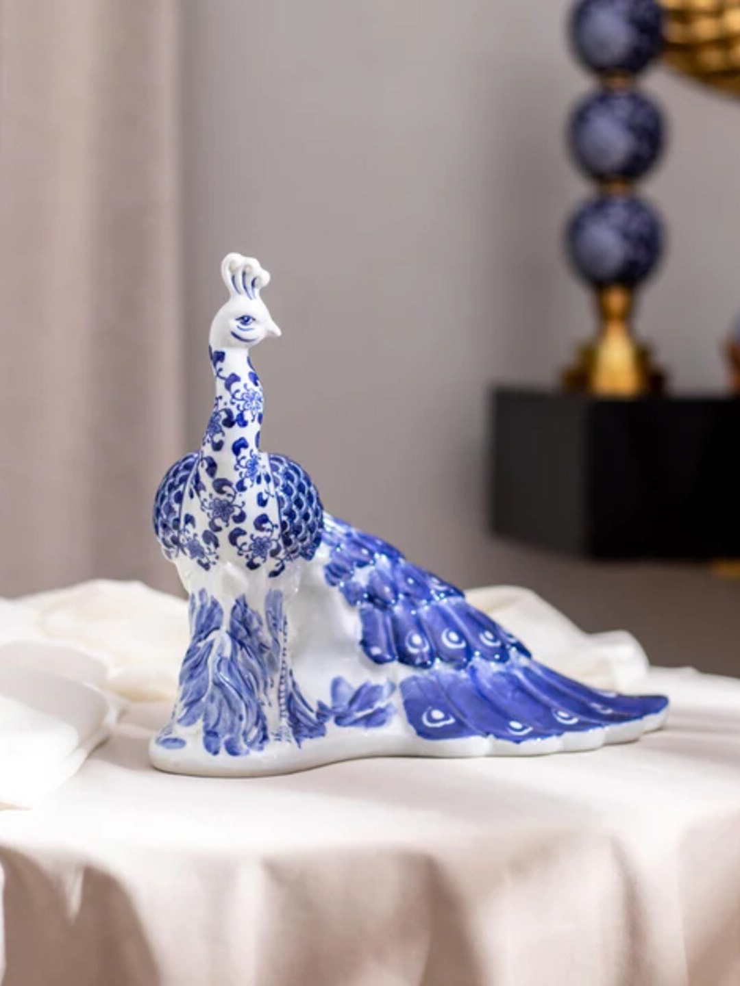 

THEDECORKART Blue & White Textured Peacock Ceramic Figurine Showpiece