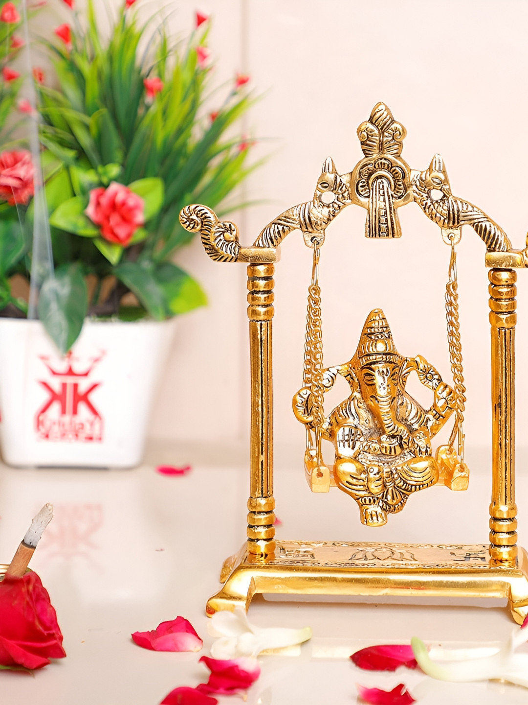 

Kridaykraft Gold-Toned Ganesh Ji Idol On Swing Jhula Metal Showpiece