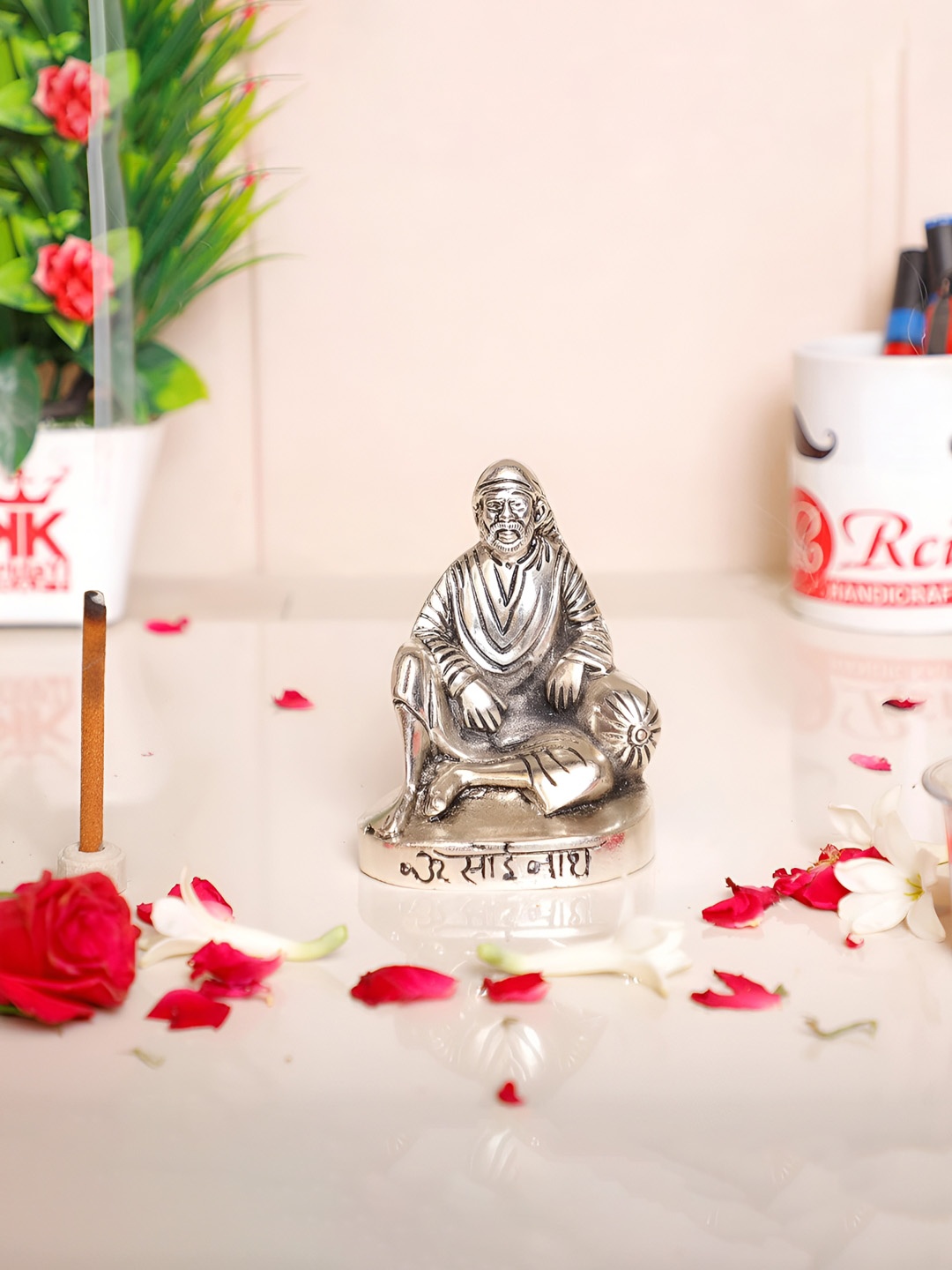 

Kridaykraft Silver-Toned Sai Baba Idol Showpiece