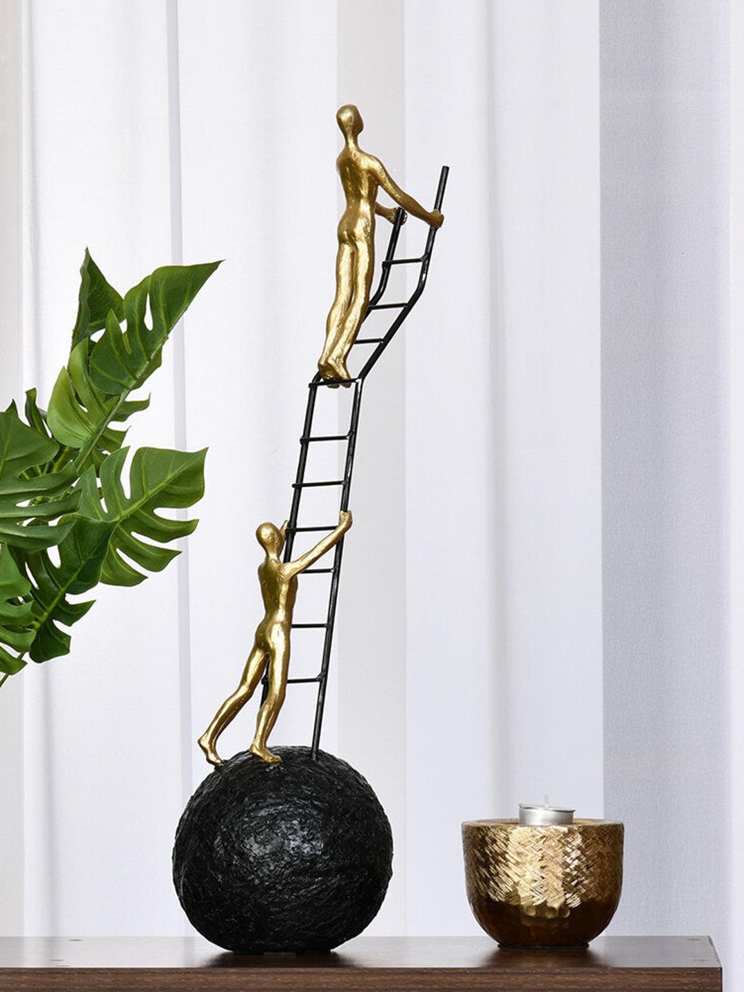 

Athome by Nilkamal Gold Toned Men Climbing Textured Polyresin Figurine Showpiece, Black