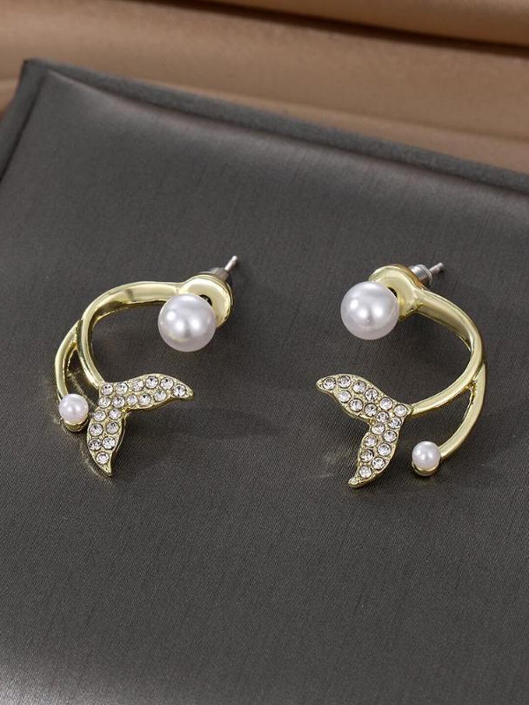 

VAGHBHATT Gold-Plated Pearl-Studded Fish Tail Contemporary Stud Earrings