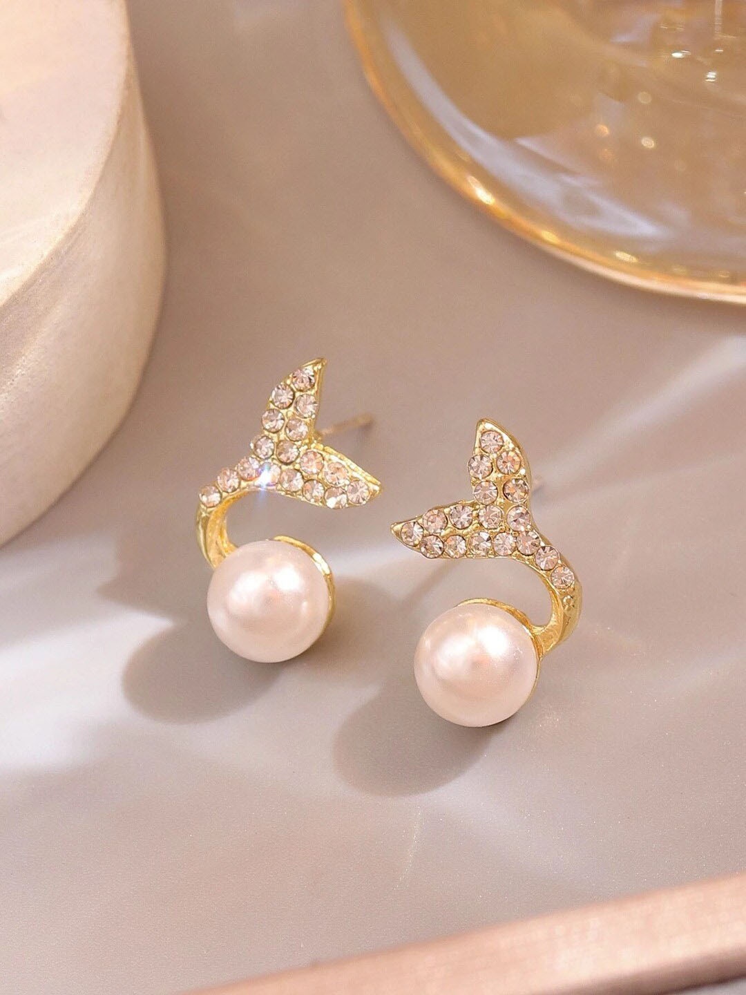 

VAGHBHATT Gold-Plated Pearl-Studded Fish Tail Studs Earrings