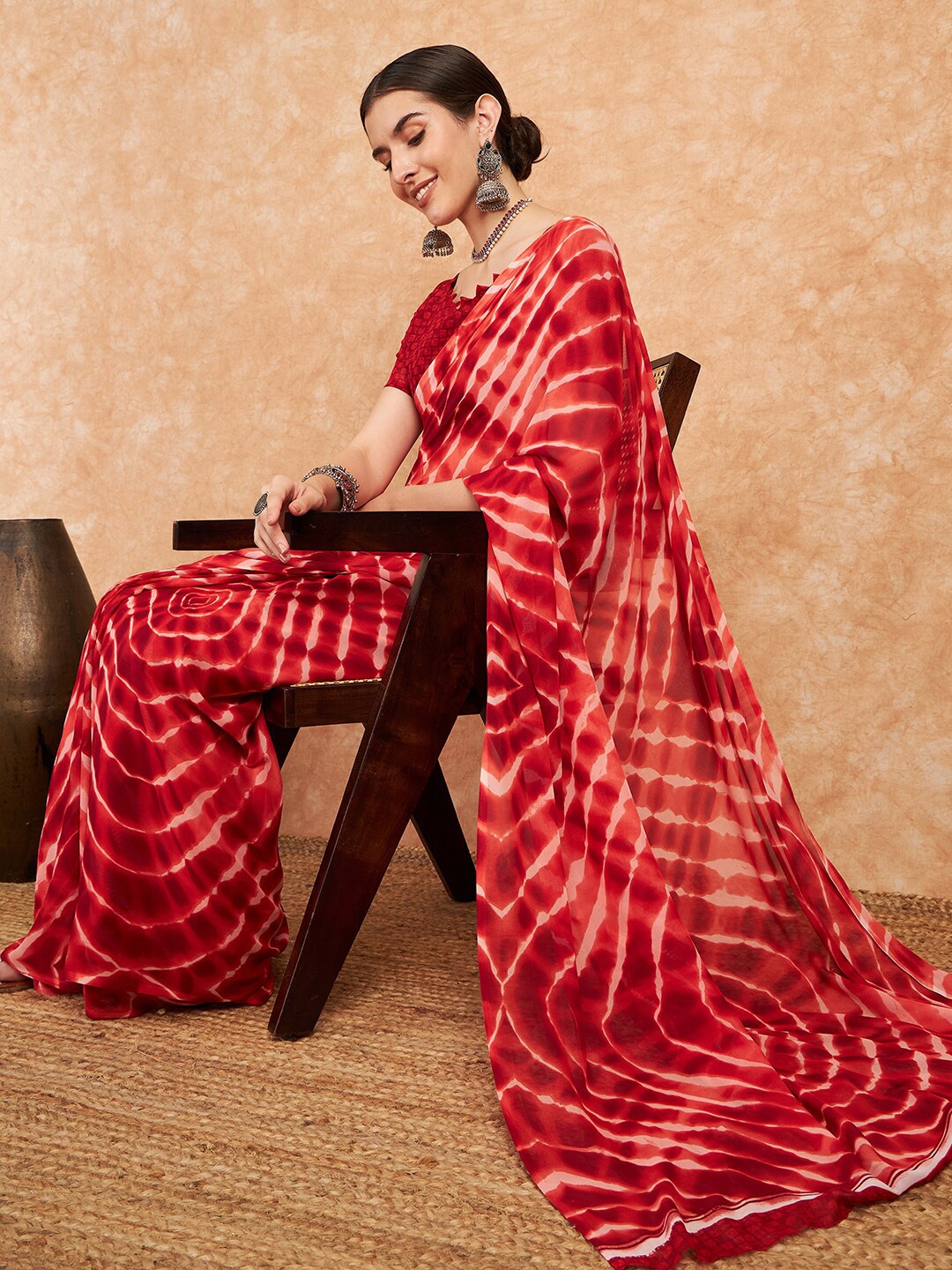 

Sangria Red Tie & Dyed Pure Georgette Saree