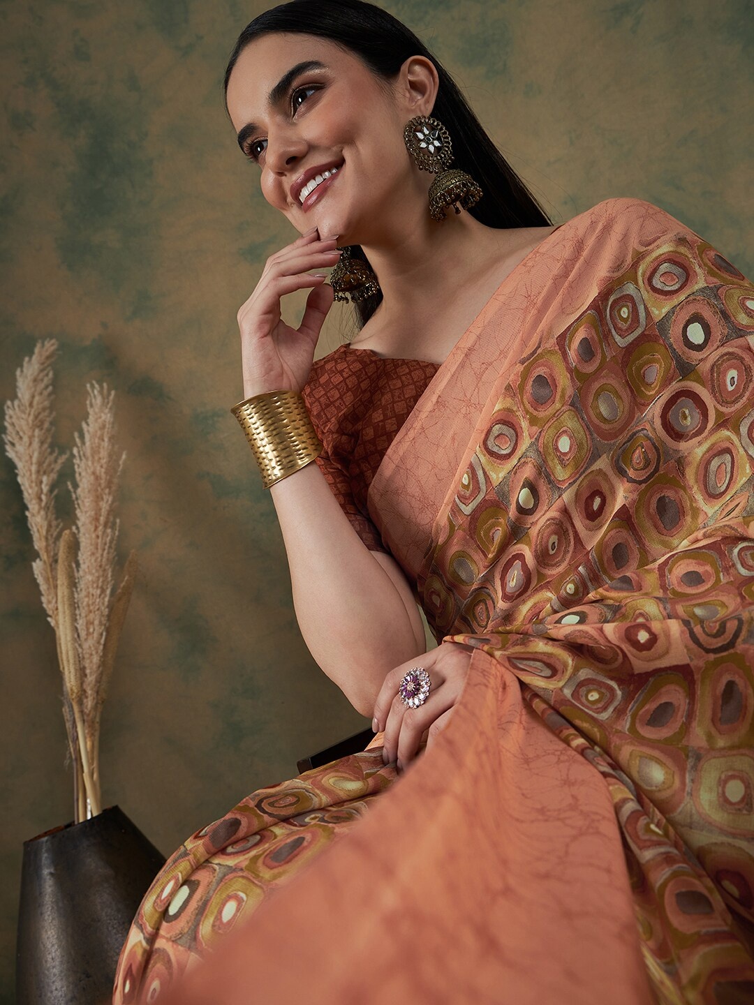 

Sangria Orange Geometric Printed Pure Georgette Saree