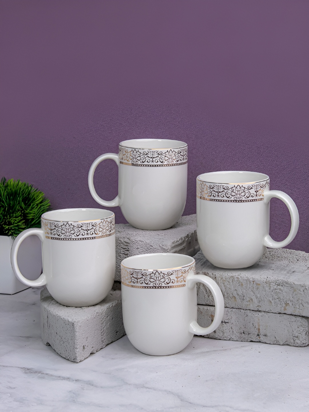 

Vola Global LLP Dazzle White & Gold Toned 4 Pieces Printed Glossy Mugs 300ml Each
