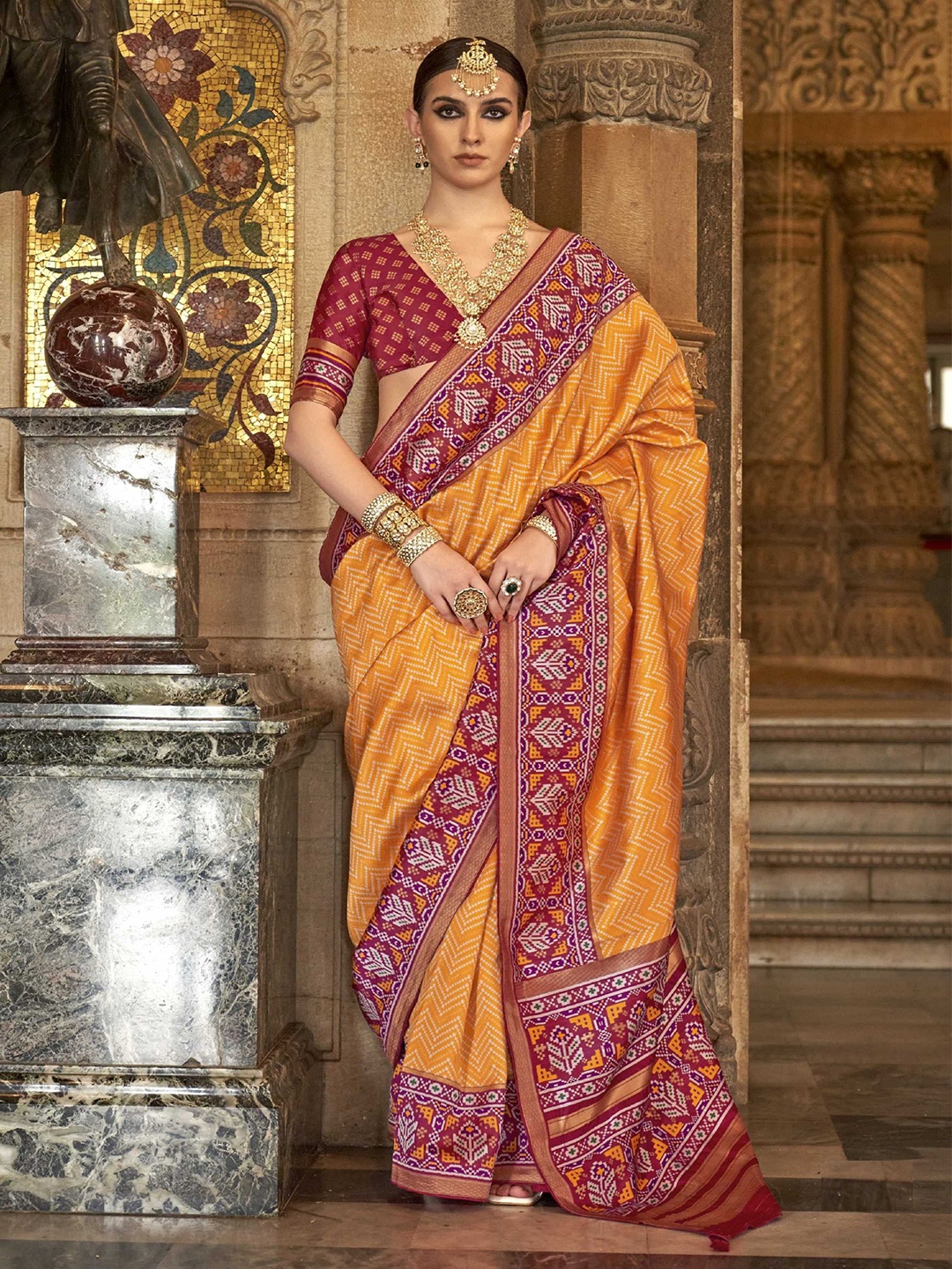 

Mitera Orange Geometric Printed Zari Patola Saree