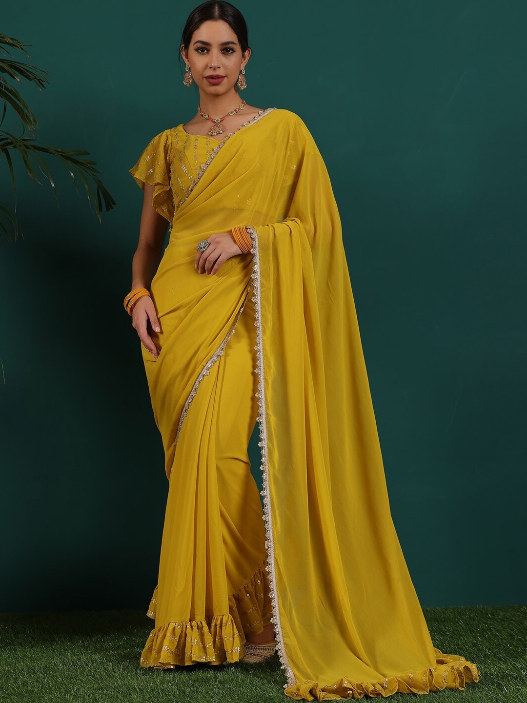 

Ethnovog Gotta Patti & Ruffled Detail Saree With Stitched Blouse, Mustard