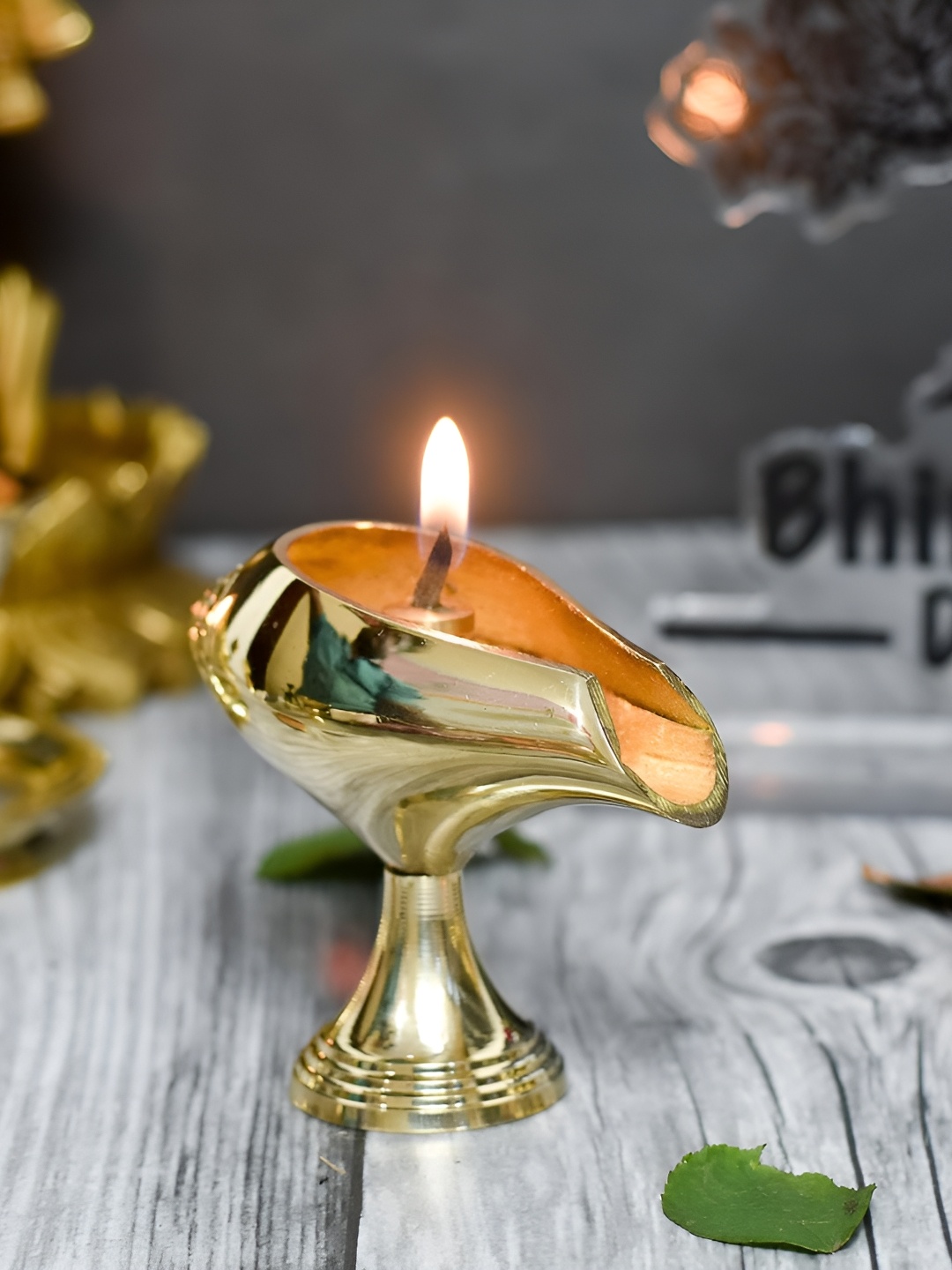 

Bhimonee Decor Gold Toned Pure Brass Shanku Chakra Table Diya Pooja Essentials