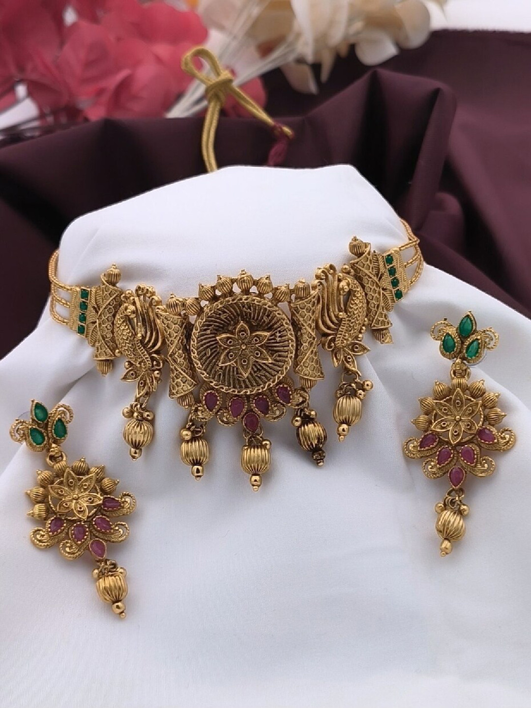 

ATIBELLE Gold Plated Stone Studded Bedded Floral-Peacock Shaped Choker Necklace & Earrings