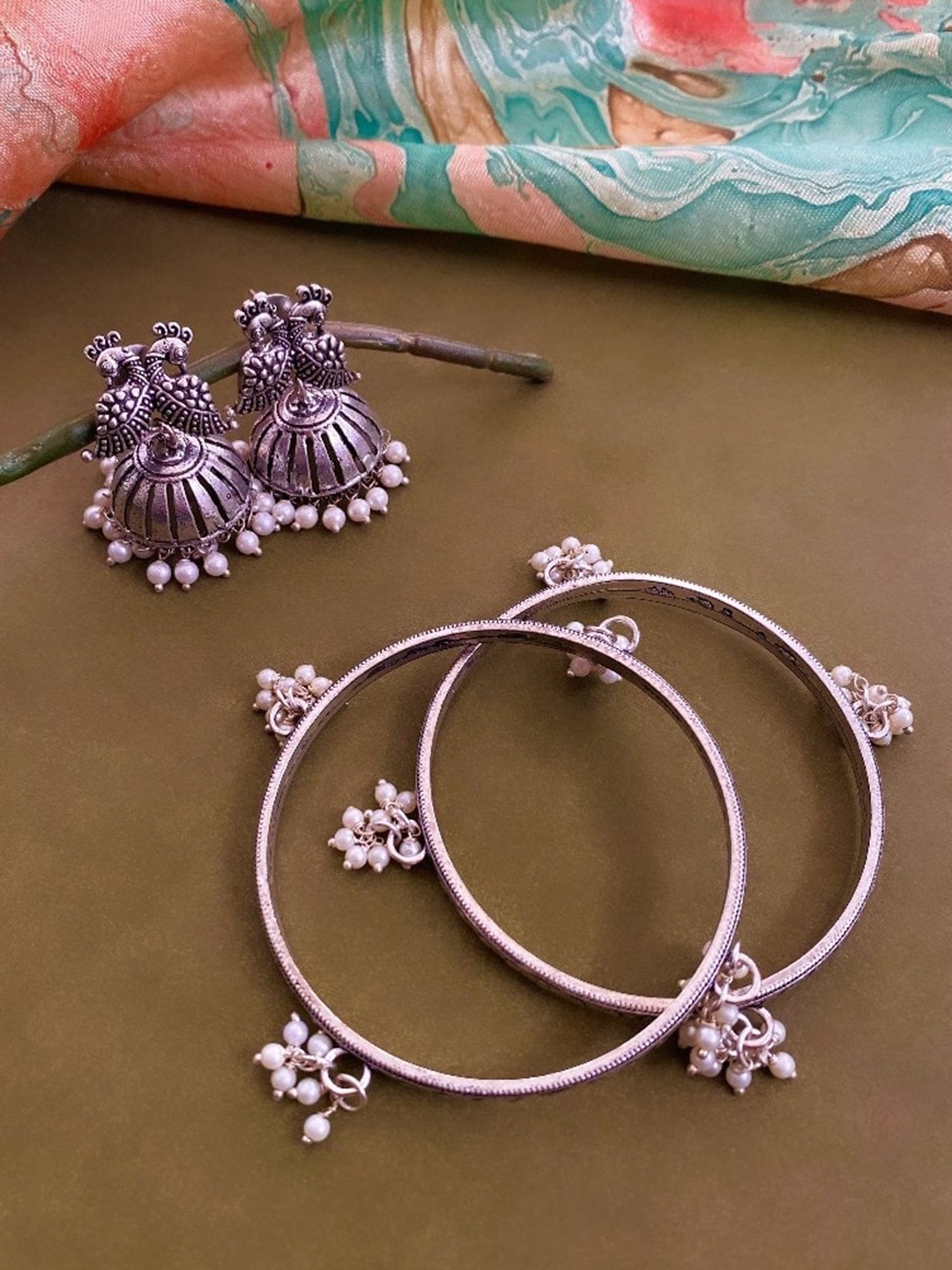 

ATIBELLE Set Of 2 German Silver Plated Peacock Shaped Beaded Bangles & Jhumkas