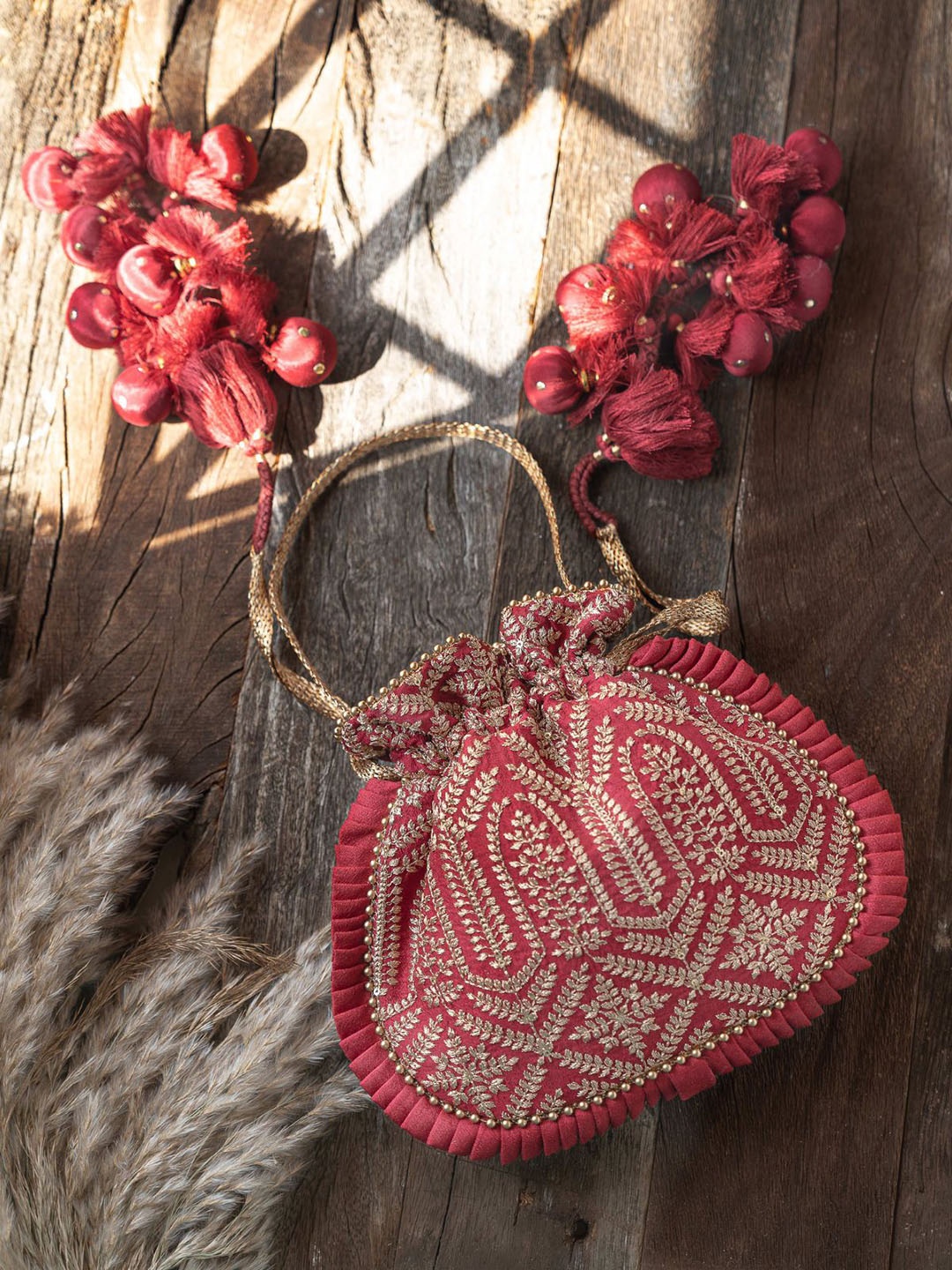 

AMYRA Embroidered Fabric Potli Clutches, Maroon
