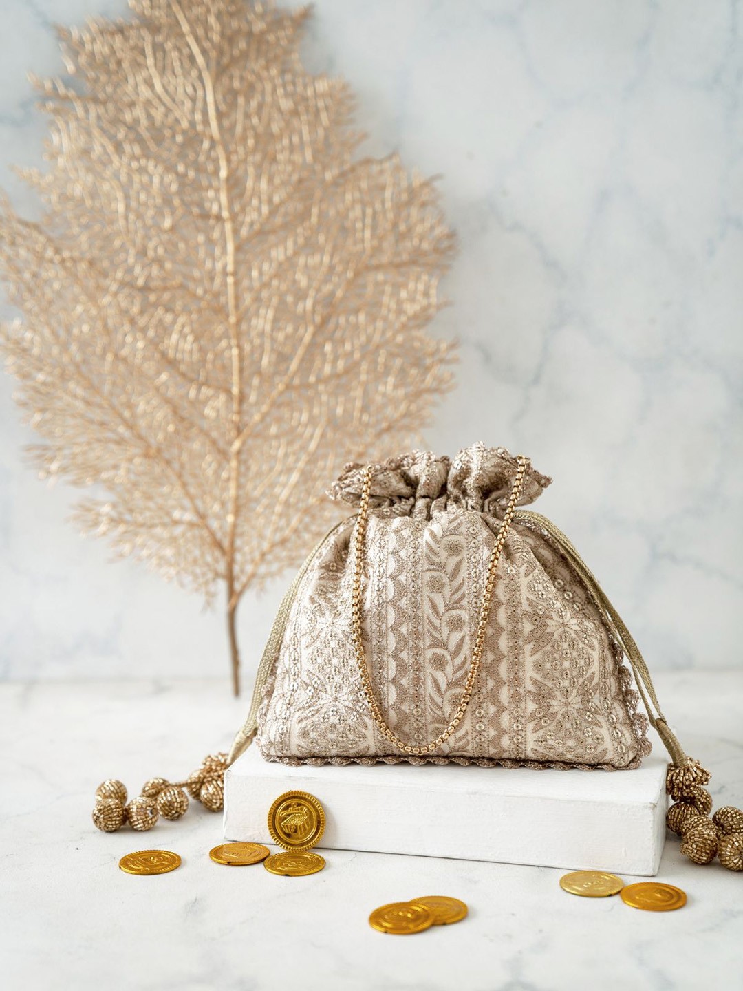 

AMYRA Embroidered Cutdana Tasselled Potli Bag, Cream