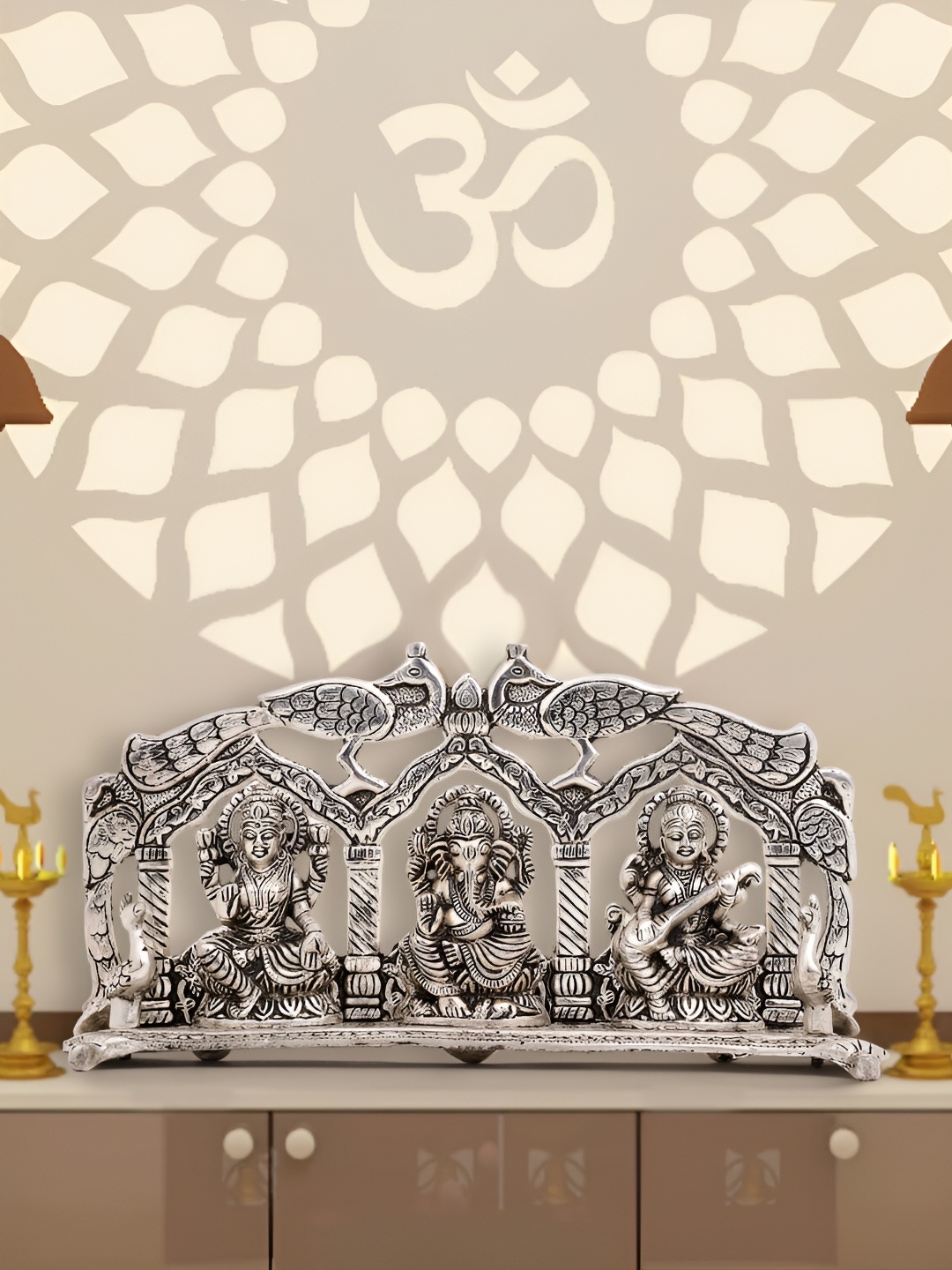 

INTERNATIONAL GIFT Silver Toned Laxmi Ganesh Saraswati Peacock Idol Showpiece
