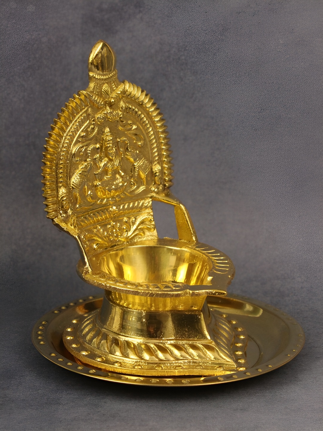 

Spillbox Gold Toned Kamachi Diya With Plate Pooja Essentials
