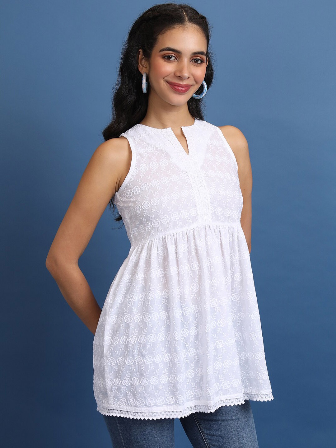 

Vishudh White Floral Embroidered Mandarin Collar Sleeveless Pleated A-Line Kurtis