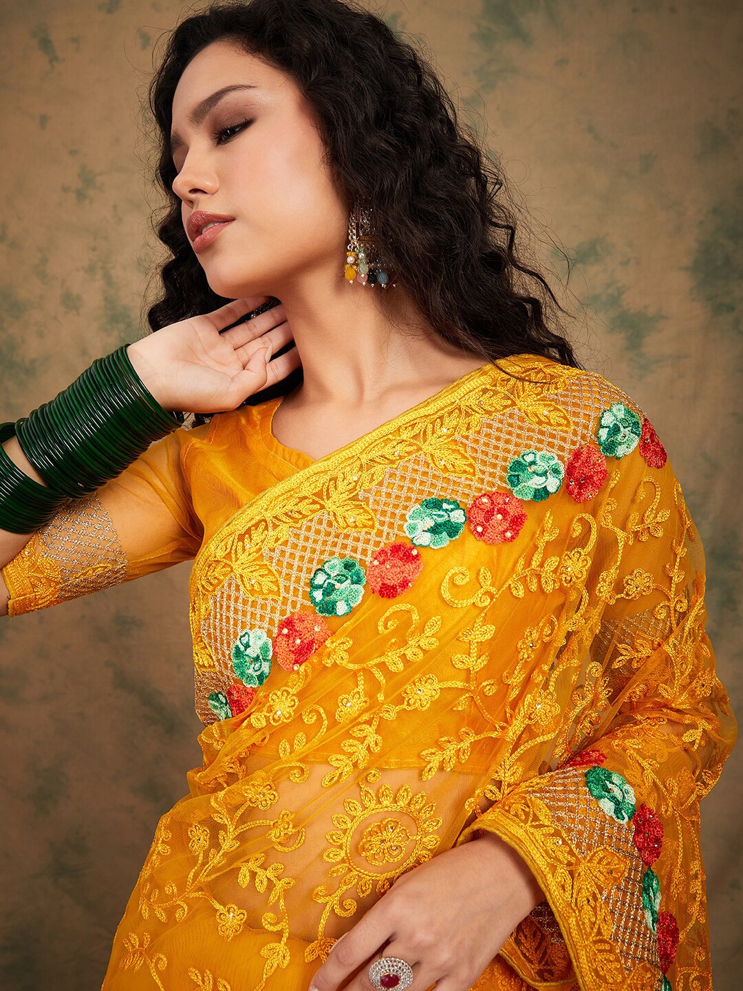 

Sangria Yellow Floral Embroidered Net Sarees