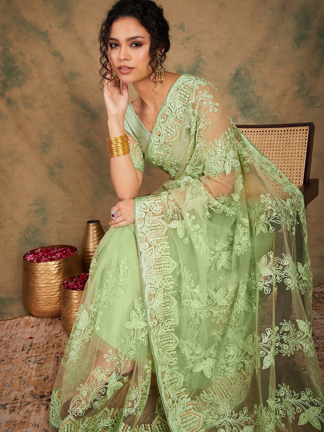 

Sangria Sea Green Ethnic Motifs Embroidered Net Saree