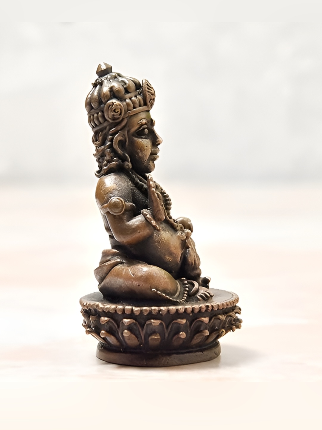 

Bhimonee Decor Copper Toned Religious Idol Showpiece