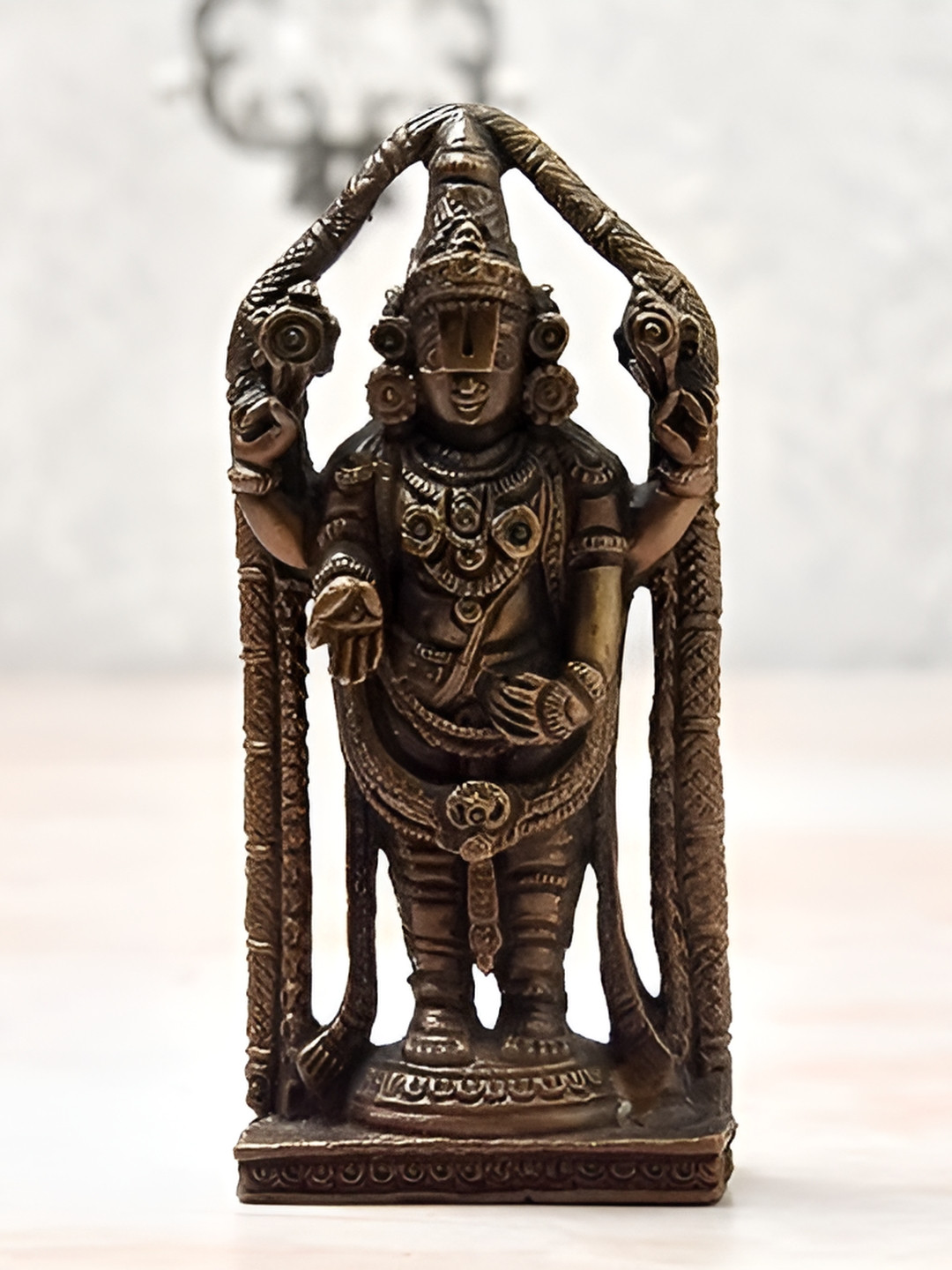 

Bhimonee Decor Copper-Toned Balaji Idol Showpiece