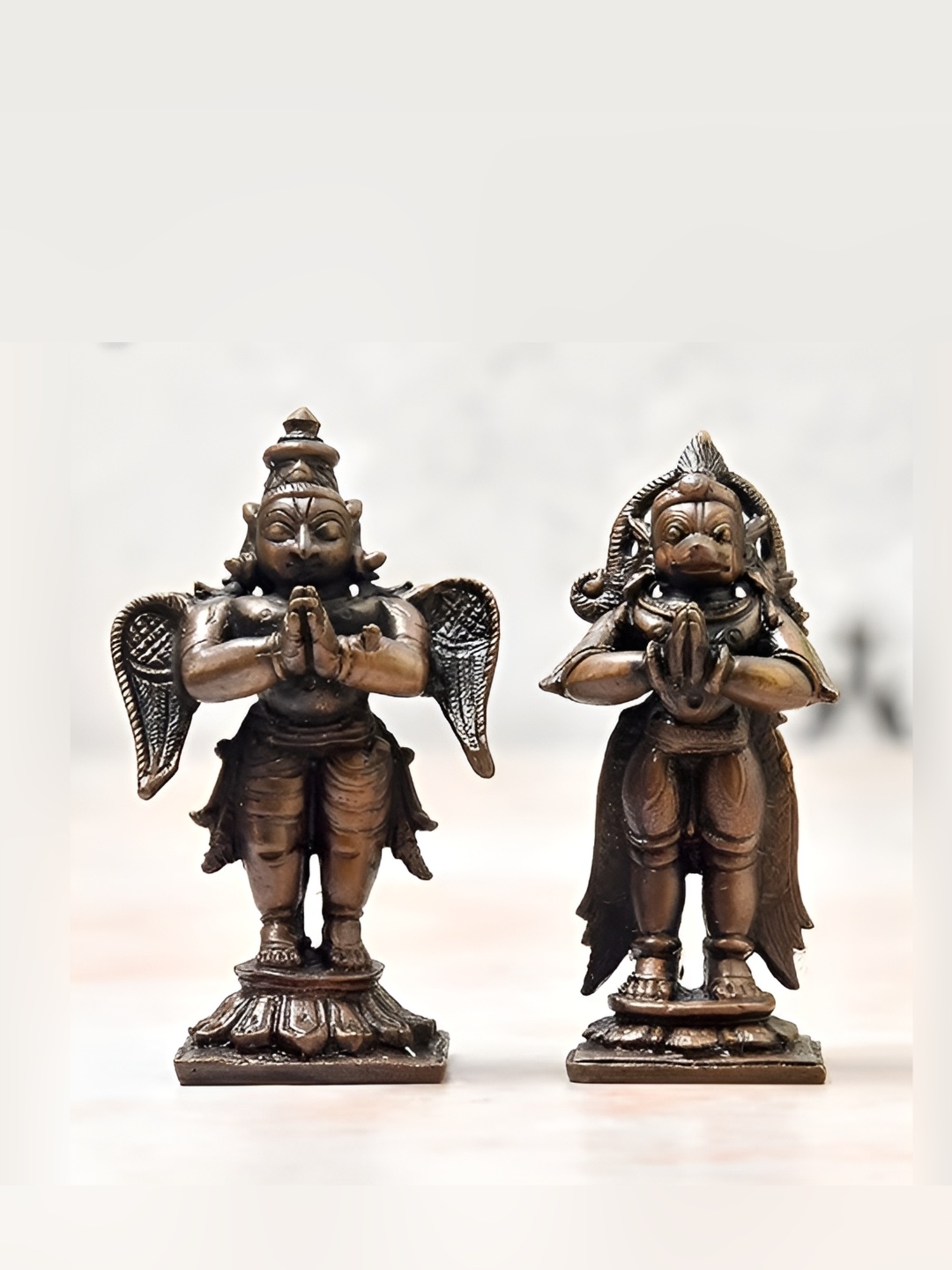 

Bhimonee Decor Copper Toned 2 Pieces Garuda Hanuman Idol Showpiece