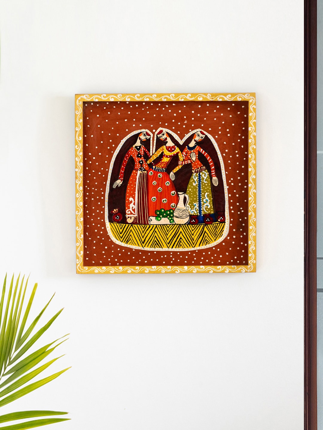 

ExclusiveLane Red & Yellow Village Women Painted Wooden Wall Hanging