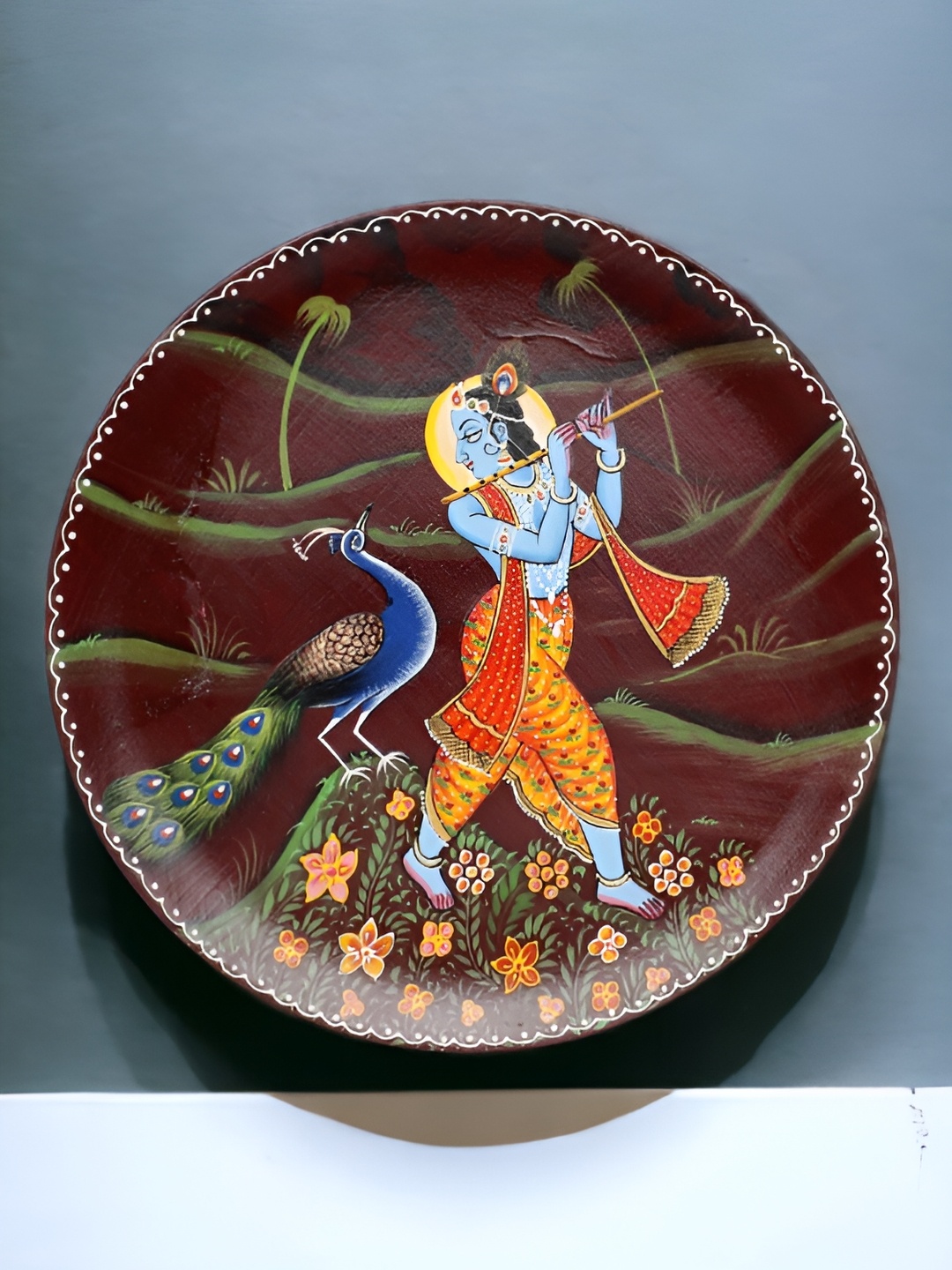 

THE COCOTIER Orange & Blue Krishna With Peacock Painted Wooden Wall Plate
