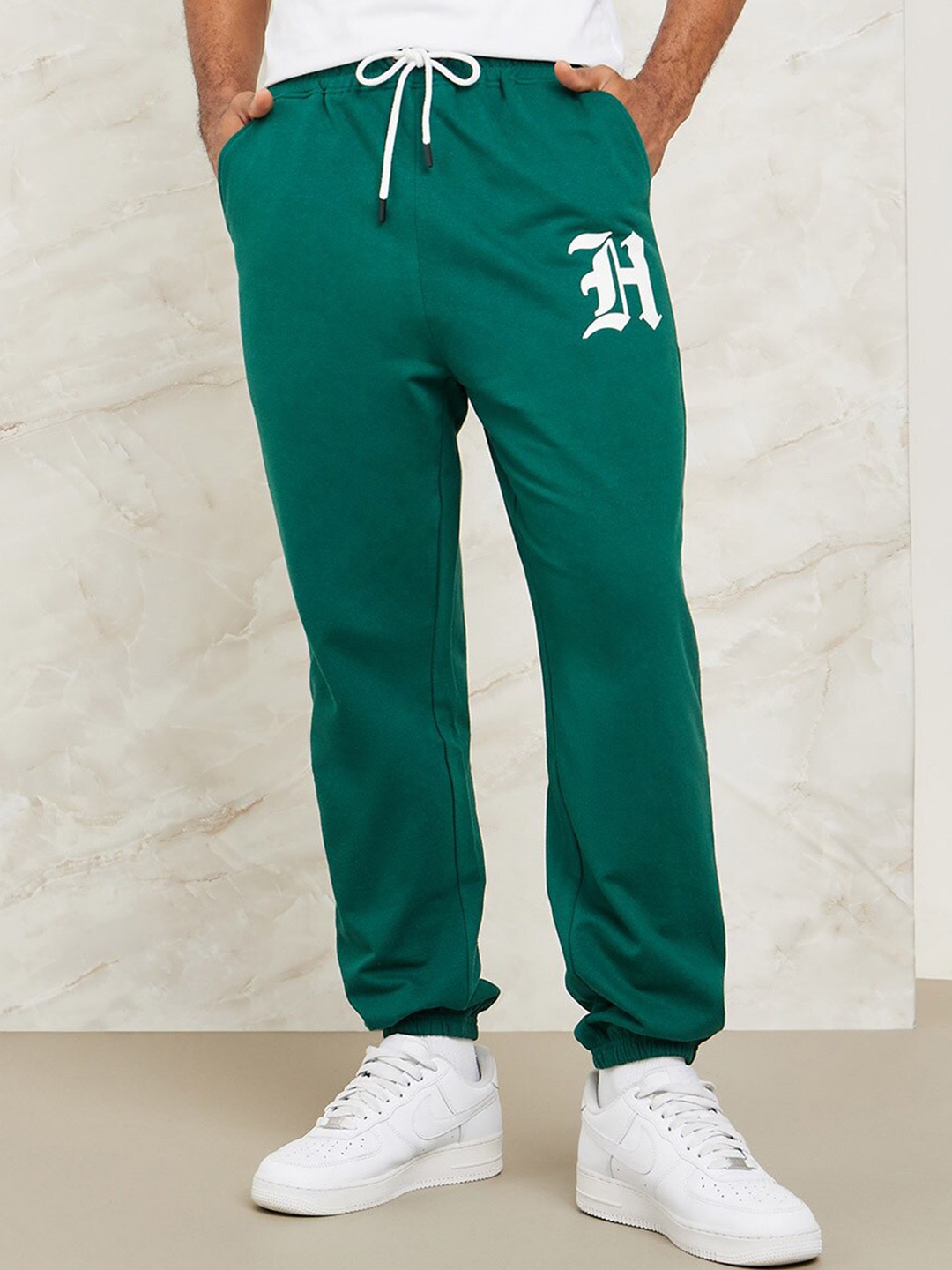 

Styli Men Typography Placement Print Oversized Joggers, Green