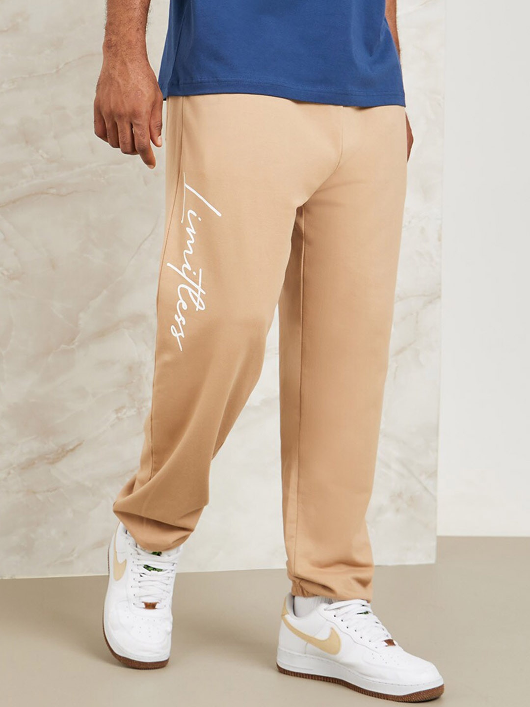 

Styli Men Slogan Print Oversized Jogger with Drawcord Detail, Beige