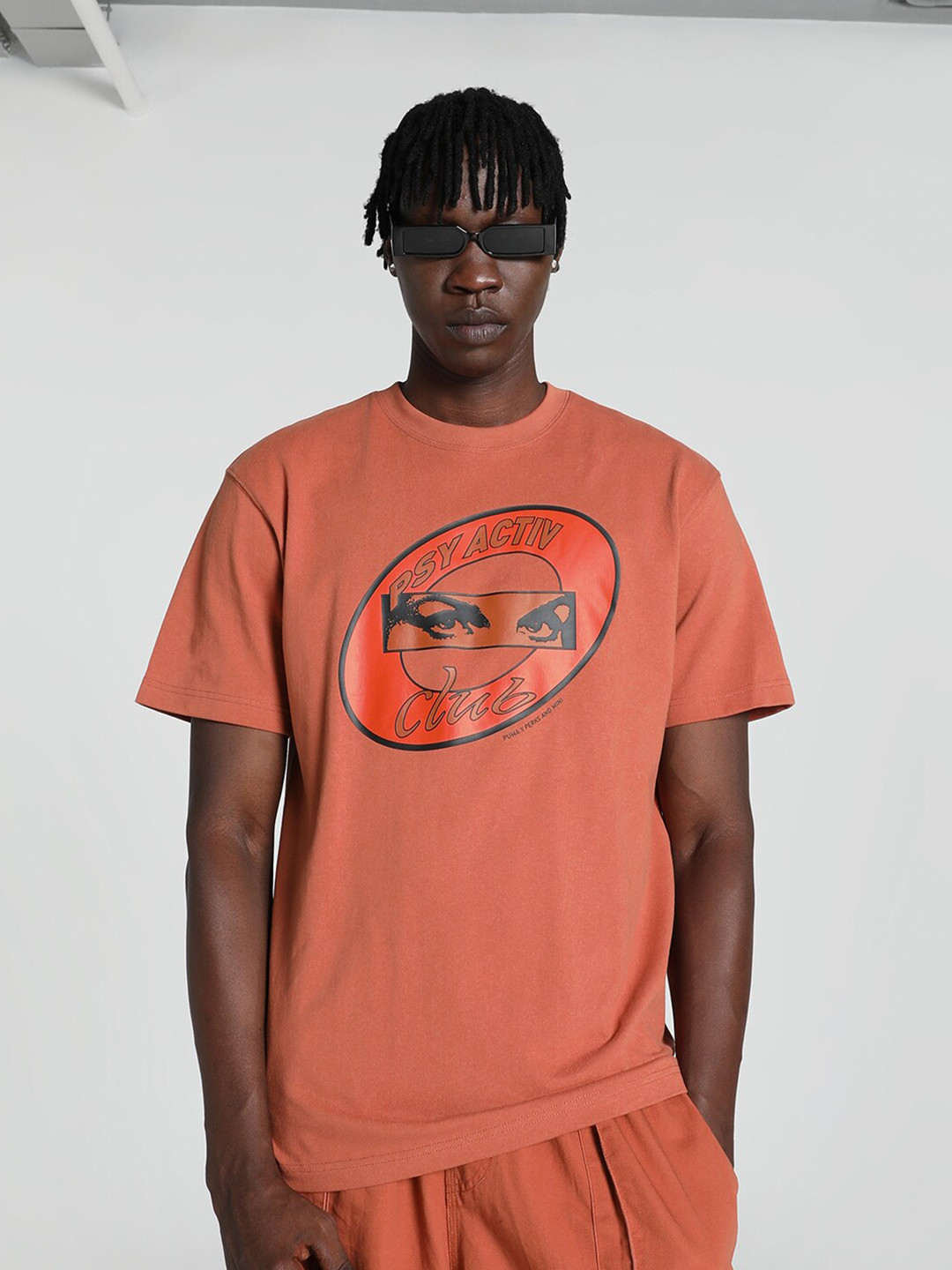 

Puma Unisex PERKS & MINI Graphic Printed Relaxed Fit Cotton T-Shirt, Brown
