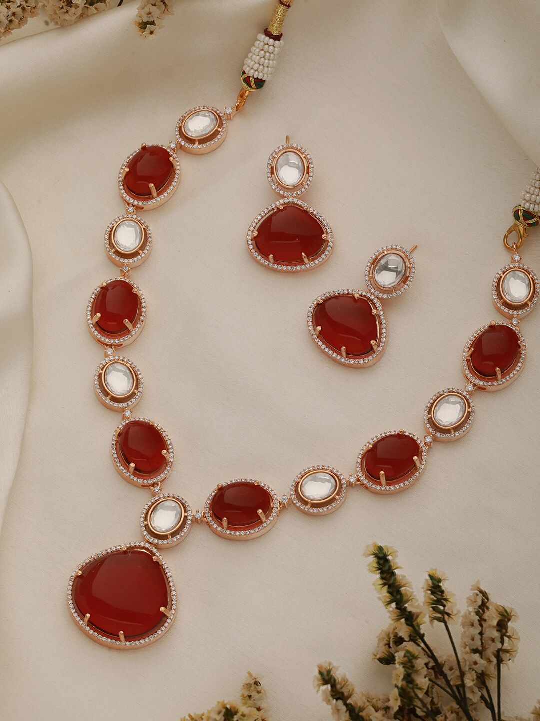 

Saraf RS Jewellery Gold-Plated American Diamond Stone Studded Jewellery Set