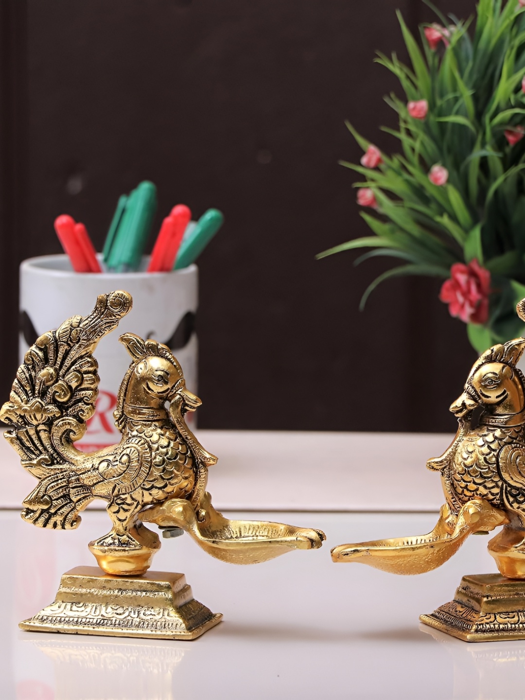

Kridaykraft Gold-Toned Metal Peacock with Diya Showpiece